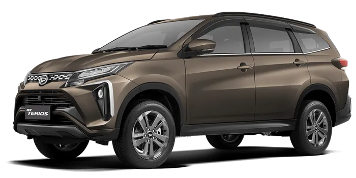 Daihatsu Terios warna bronze metallic mengkilap diparkir di luar ruangan.